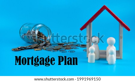 Property investment, house mortgage financial planning and real estate home refinancing concept. Selective focus on a toy house and a family wooden doll with a bottle of coins