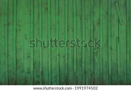 Old vintage wooden wall with color peeling paint for background.