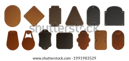 Leather label. Realistic blank badges. Premium bag tags. Jeans patches stitched at edges with copy space. Isolated stickers set for branding. Vector natural or faux calfskin samples Royalty-Free Stock Photo #1991983529