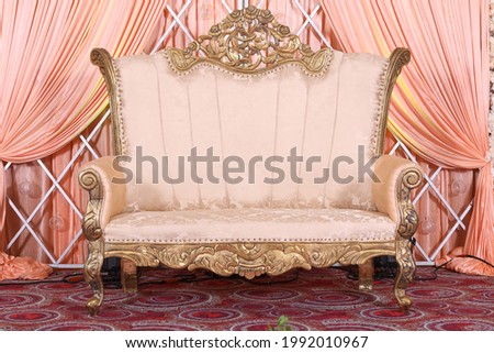 close up of leather couch on a stage with reception decoration in indian wedding Royalty-Free Stock Photo #1992010967