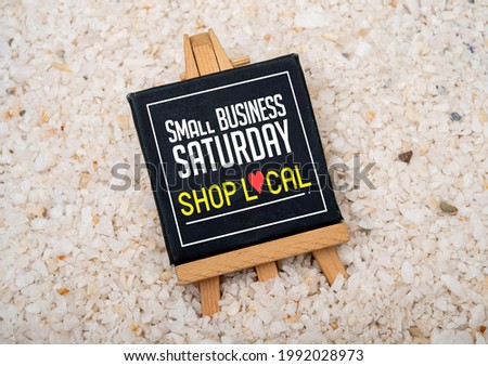 Small Business Saturday and shop local sign for businesses. Royalty-Free Stock Photo #1992028973