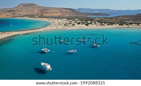 Aerial photo taken by drone of Caribbean tropical exotic island bay with turquoise clear sea sandy beaches resembling a blue lagoon visited by sail boats