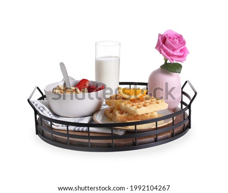 Tray with delicious breakfast and beautiful flower on white background