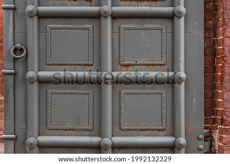 old grey metal gate with beautiful decor