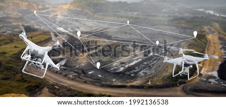 Innovation aerial uav drone copter flying with camera above opencast mining open coal. Concept engineering geology industry. Royalty-Free Stock Photo #1992136538
