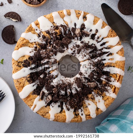 Bundt pound cake with chocolate sandwich cookies and sugar glaze