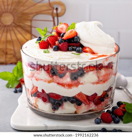 Summer berry red, white and blue trifle with angel food cake in a large bowl. Dessert for 4th of July, Independence day sweet treat Royalty-Free Stock Photo #1992162236