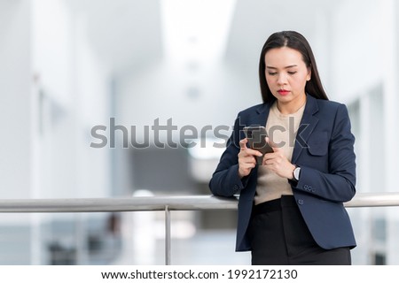 portrait of A middle-aged Asian working women looking at camera