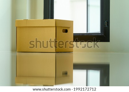 Cardboard Boxes in empty room at new home apartment