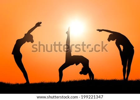Silhouette woman practice yoga at sunset