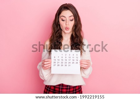 Photo of young attractive girl amazed look calendar day month time management isolated over pastel color background