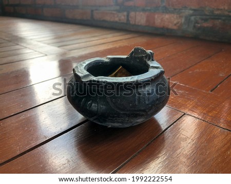 Abstract ashtray in room