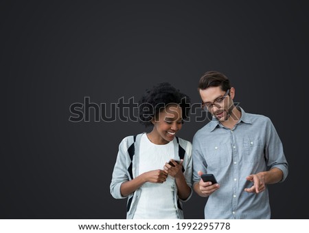 Composition of man and woman using smartphones with copy space on grey background. writing background technology, social media and colour concept digitally generated image.
