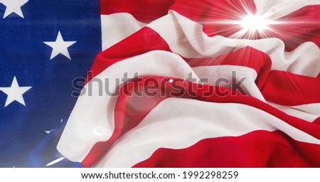 Bright spot of light against close up of american flag. american independence template background design concept