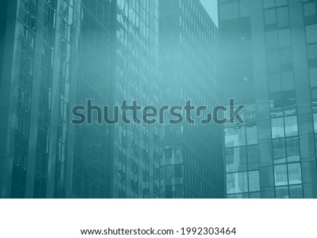 Composition of blue tint over modern office block buildings in a city. business community and development concept digitally generated image.