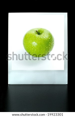  instant photo of an apple on a white background