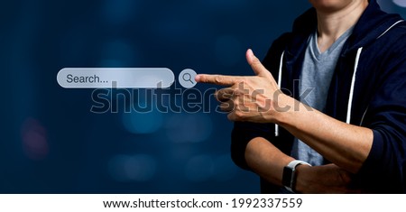 Man touching on search icon on virtual screen. Panoramic of Searching internet data Information Concept with copy space