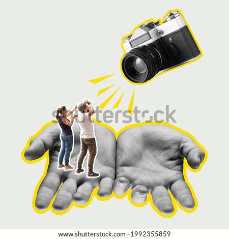 Focus on the male hands. Retro vintage camera and small people. Modern design. Contemporary art collage.