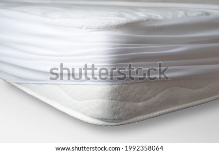 Moisture-proof cover on the orthopedic mattress to protect against water and dust mites Royalty-Free Stock Photo #1992358064