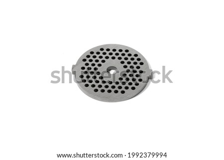 
Metal mesh for electric meat grinders. Made of high carbon magnetized stainless steel. Heat treatment. Resistant to wear and corrosion. Fine lattice. White background.