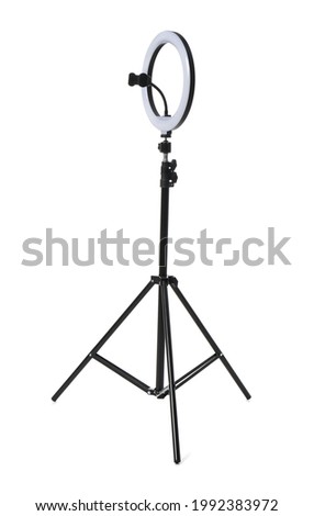 Modern tripod with ring light isolated on white