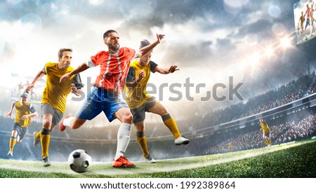 Profeccional soccer players in action on the grand stadium background