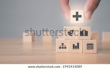 profit and benefit positive concept, Businessman offer positive thing (such as profit, benefits, development, CSR) represented by plus sign and business growth icon. Royalty-Free Stock Photo #1992414089
