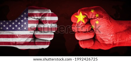United States Vs China Flag Painted on a Fist Pointing Towards Each Other. Modern Business and political conflict background