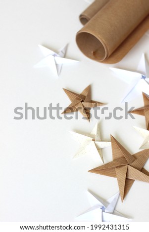 Christmas and New Year White Background with Origami Stars. Holiday Mock-up.