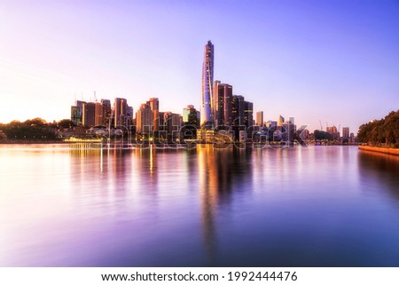 City of Sydney cityscape skyline around Barangaroo high-rise towers across Harbour at sunrise.
