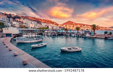 Fantastic spring cityscape of Saranda port. Captivating Ioninian seascape. Wonderful evening scene of Albania, Europe. Traveling concept background. Royalty-Free Stock Photo #1992487178