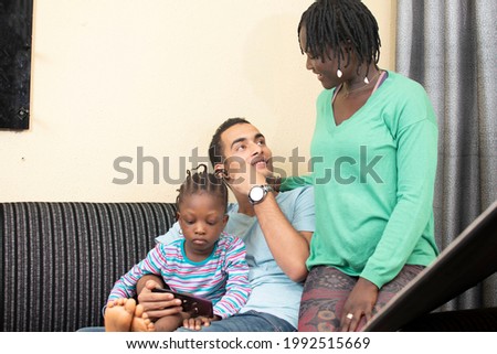 interracial family sitting on the couch