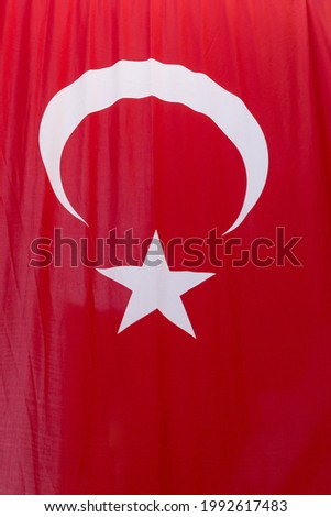 close up crescent and star on hanging Turkish flag