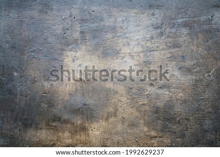 Grungy dark concrete wall with stucco, background photo texture, industrial construction backdrop