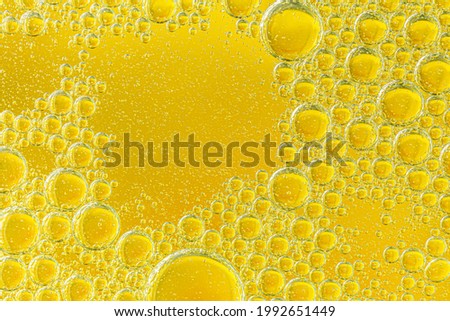 macro yellow bubbles,golden yellow bubble oil, abstract background