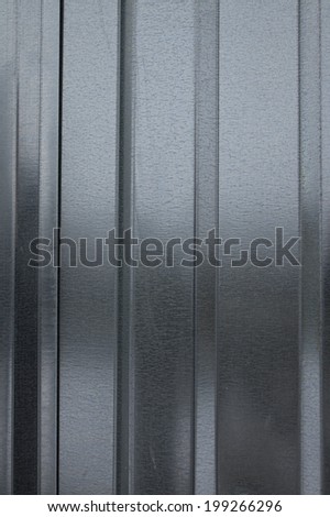 Corrugated steel sheet useful as a background