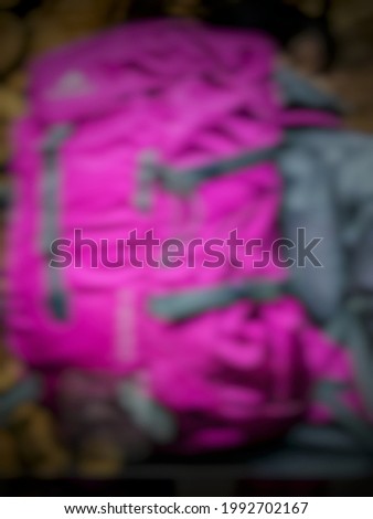 abstract blur background photo of a backpack that is worn on the back used when hiking and camping