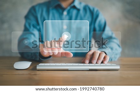man using mouse and keyboard for streaming online, watching video on internet, live concert, show or tutorial