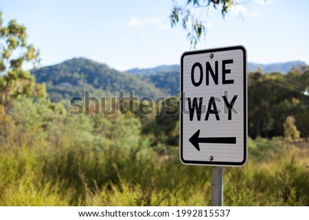 A one way sign on a remote road amongst the bush and near the high country mountains of Jamieson, Victoria, Australia.