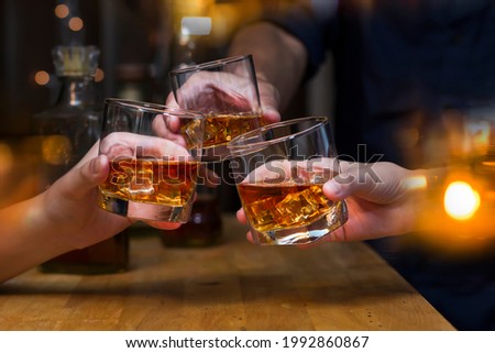 whiskey, for a friendly party in a bar or a restaurant. Royalty-Free Stock Photo #1992860867