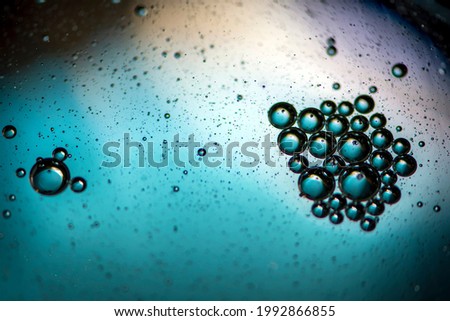Blue background. Abstract macrophotography. Oil bubbles. Water texture.