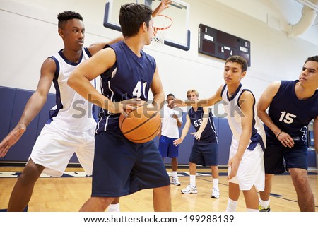 Male High School Basketball Team Playing Game Royalty-Free Stock Photo #199288139