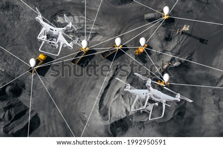 Smart industry concept, control and coordination of dump trucks with aerial uav drones on opencast mining open coal, Innovation engineering. Royalty-Free Stock Photo #1992950591