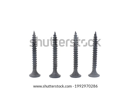 Close-up of black metal screws isolated on white background.