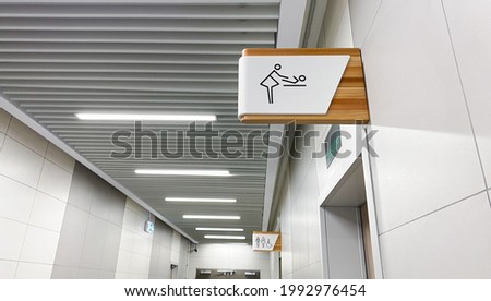 Public toilet sign for restroom. Baby changing facilities and feeding area. Men, women and disabled lavatory  on blurred background