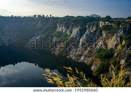 Grand Canyon Chonburi (KIRI) is a popular landmark photo view point for tak a picture, this tree-ringed former quarry features a reservoir at its bottom. Chonburi Province, Thailand.