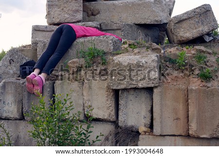 Photo of a woman posing outdoors on the concrete ruins. High resolution concept picture