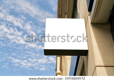 White blank sign as a mock-up template for company logo design on building