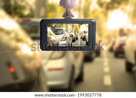 Modern dashboard camera mounted in car, view of road during driving Royalty-Free Stock Photo #1993027778