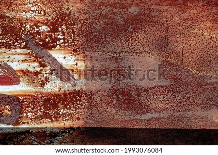 Rust on metal. Texture, background, pattern. When iron comes into contact with water and oxygen, it rusts. If salt is present, such as in seawater or salt spray, iron tends to rust more rapidly.